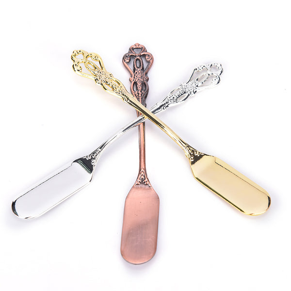 http://my-posh-kitchen.myshopify.com/cdn/shop/products/1pcs-Vintage-hollow-engraving-romantic-stainless-steel-gold-silver-plated-butter-knife-luxurious-elegant-and-classical_a996d54e-c552-401c-841c-c3e691d37eca_600x.jpg?v=1512981384